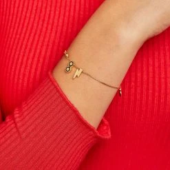 Harry Potter™ Glasses + Lightning Bolt Slider Charms, Set Of 2 12 Harry Potter™ Glasses + Lightning Bolt Slider Charms, Set Of 2 -Alex And Ani Bracelets Shop harry potter glasses lightning bolt slider charms set of 2 on model AS21CYOGLG